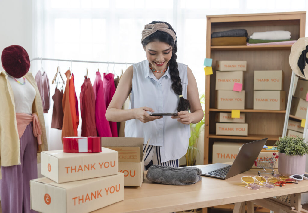 Young woman working from home following tips for selling on Amazon