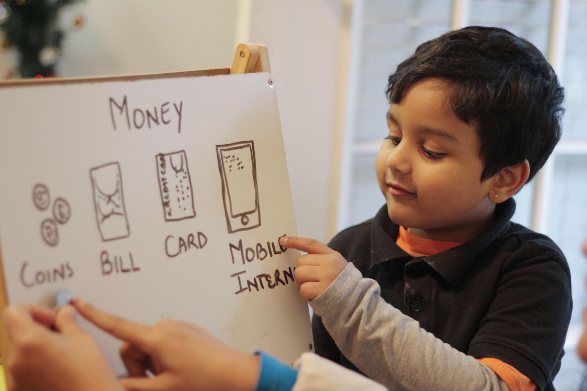 little boy presenting his cash flow plan