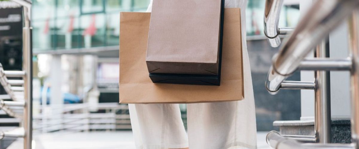 close-up-woman-carrying-shopping-bags