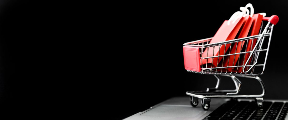 front-view-cyber-monday-shopping-cart-with-bags-copy-space