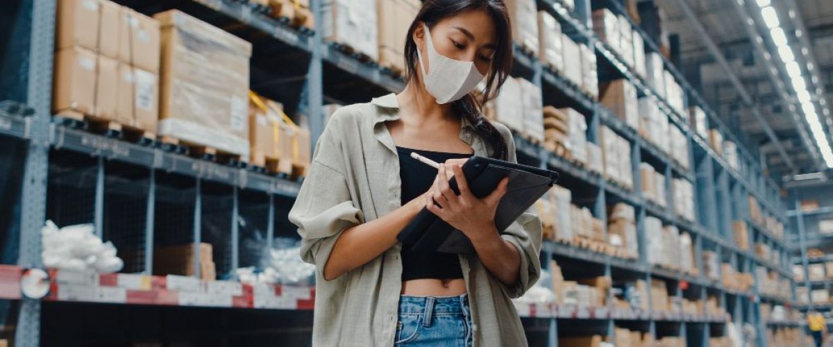 young-asian-businesswoman-manager-wearing-face-mask-warehouse-using-digital-tablet-checking-inventory
